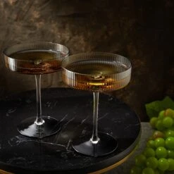Ribbed Coupe Cocktail Glasses 8 Oz | Set Of 2 | Classic Manhattan Glasses For Cocktails, Champagne Coupe, Ripple Coupe Glasses, Art Deco Gatsby Vintage, Crystal With Stems (Smoke Grey) -Refined Spirits Store 2022 11 23 A AEa 1972 3