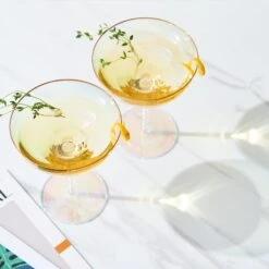 Iridescent Colored Gilded Rim Coupe Glass, 2-Set Large 9oz Rainbow Cocktail & Champagne, Luster Pearl Glasses Vibrant Color Gold Vintage Tumblers, No Stem Margarita, Glassware Gift - The Wine Savant 9 Iridescent Colored Gilded Rim Coupe Glass, 2-Set Large 9oz Rainbow Cocktail & Champagne, Luster Pearl Glasses Vibrant Color Gold Vintage Tumblers, No Stem Margarita, Glassware Gift - The Wine Savant -Refined Spirits Store Gildedrimchampagnecoupeiniridescent setof22